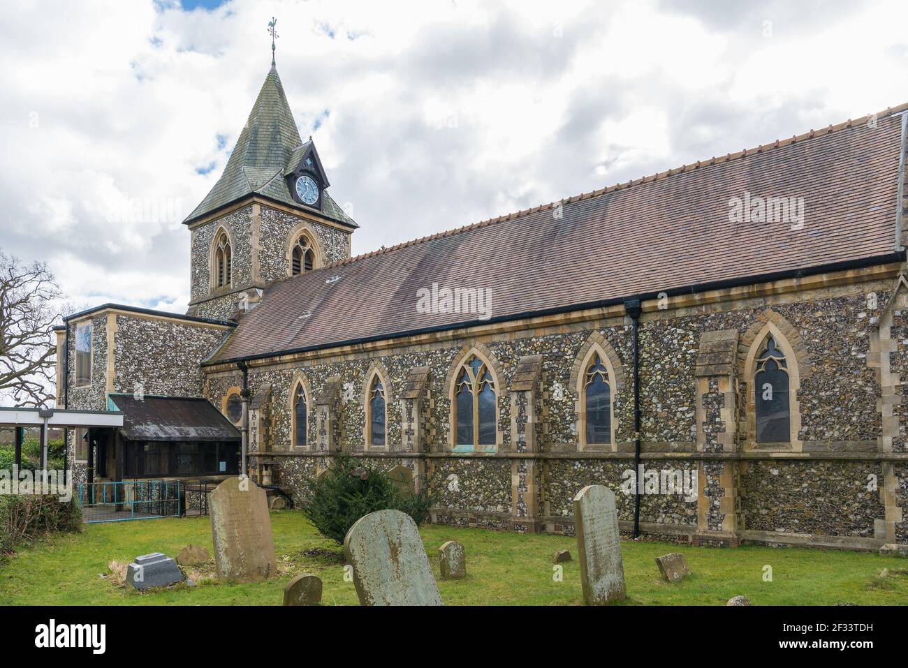 Holy Trinity Church, a flint built with steeple Church of England