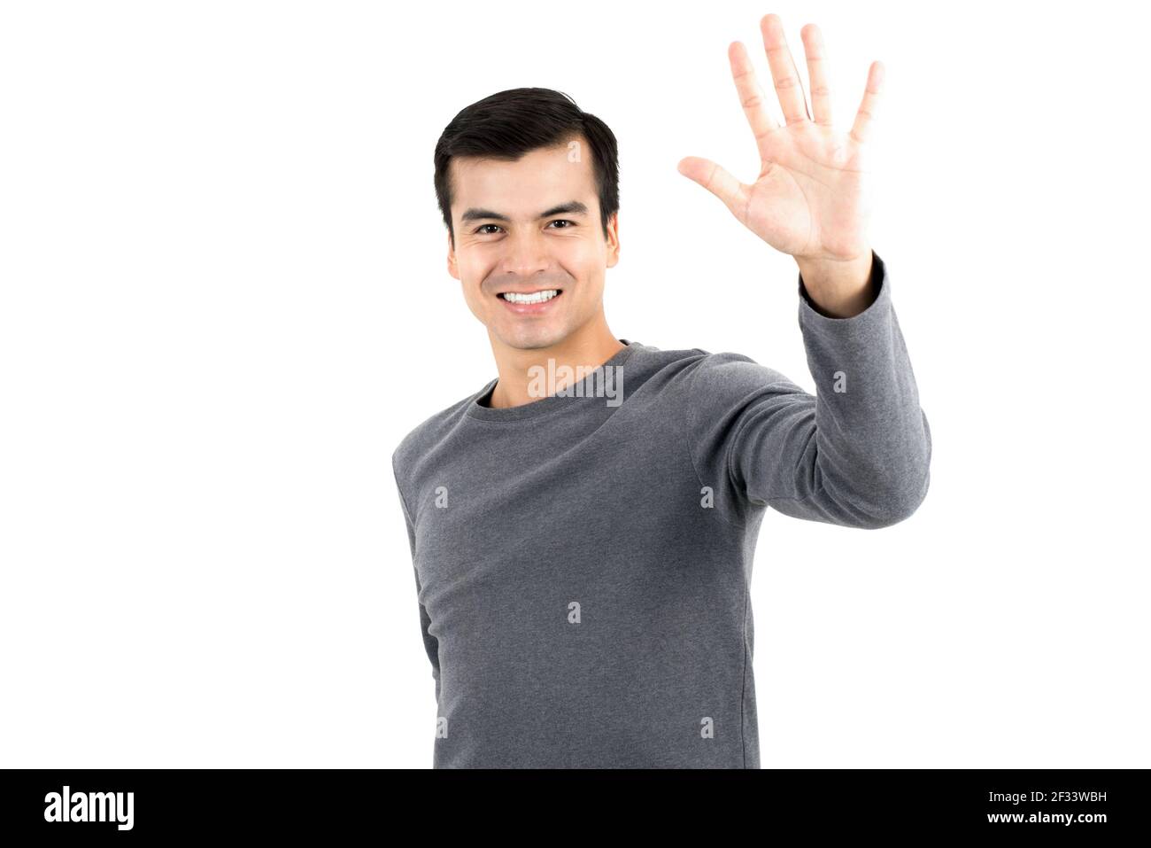 Young man making high five gesture - isolated on white background Stock Photo