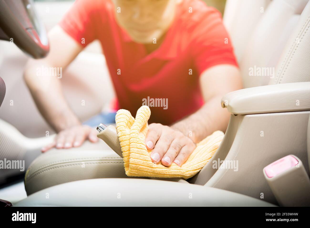 A man cleaning car interior - auto detailing and valeting  concept Stock Photo