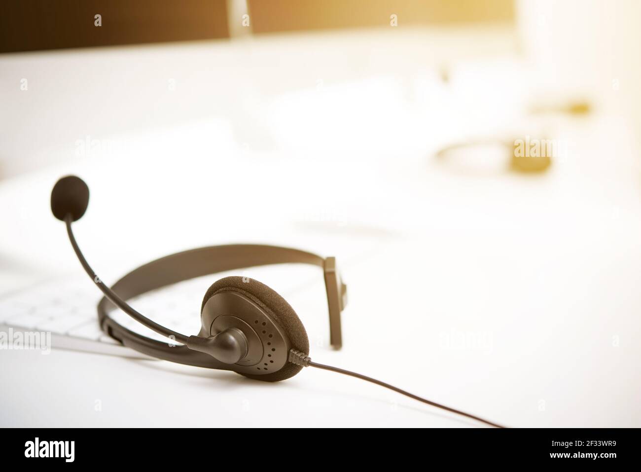 Microphone headsets on the table with computer keyboard call center