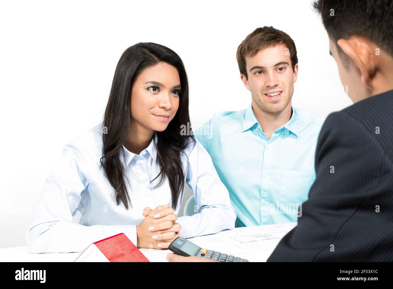 Interracial couple meeting with financial adviser Stock Photo