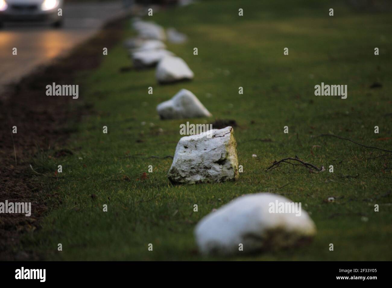 Stones along a road in sunset lighting, Macro and Close up Stock Photo