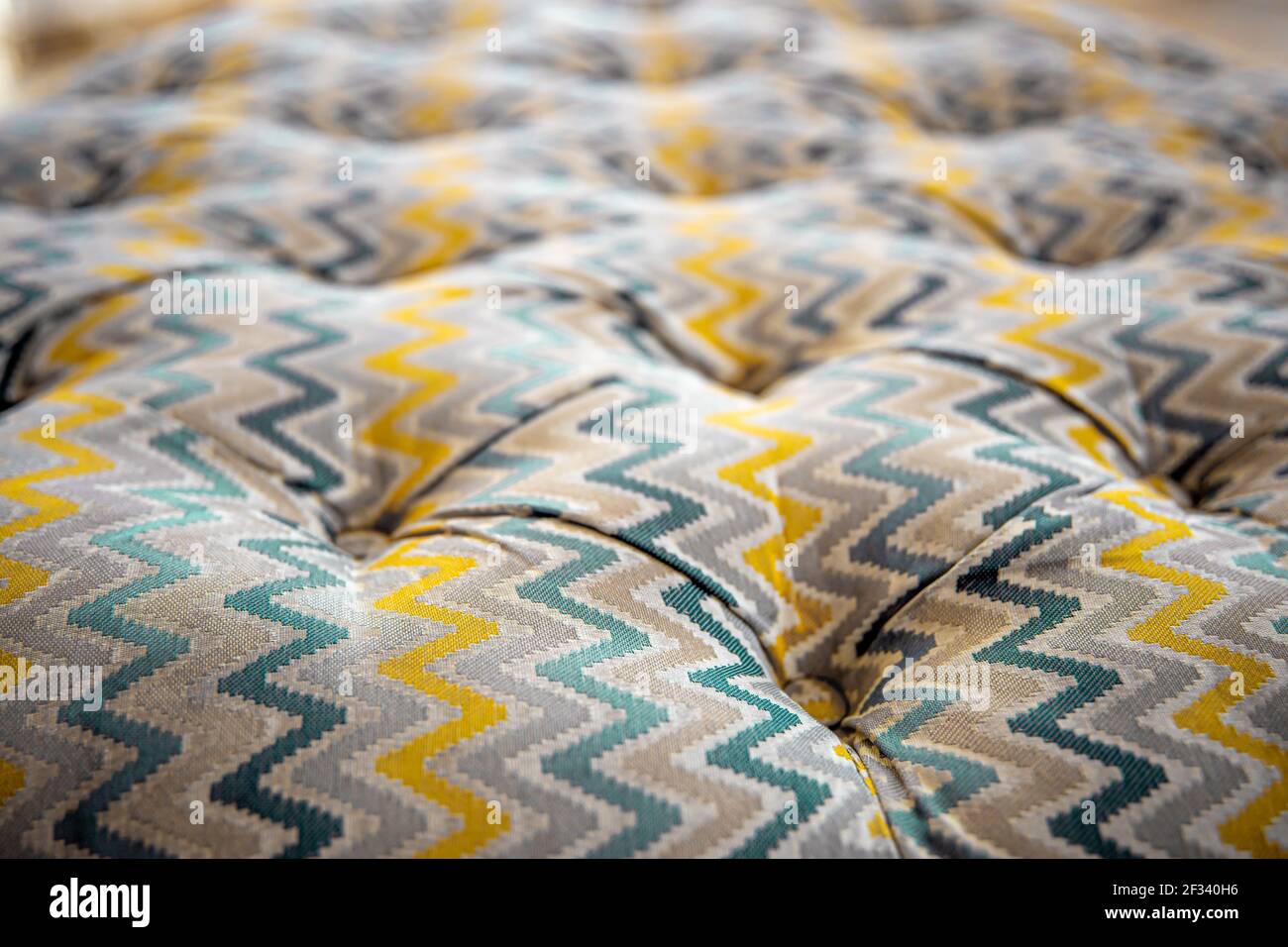 Close up of mottled soft sofa texture with sunken buttons. Idea and ...