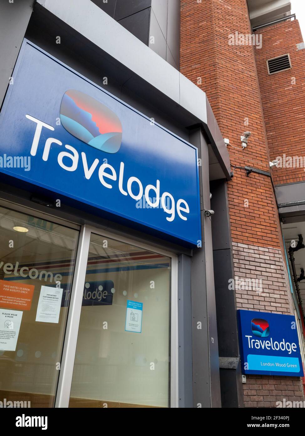 The entrance and logo of a branch of Britain's largest privately owned hotel chain Travelodge. Stock Photo