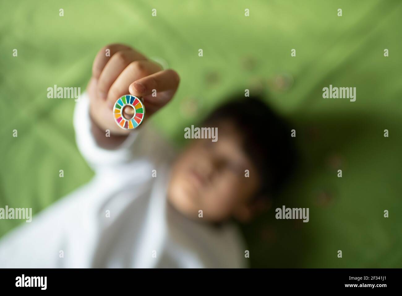 Boy Having Pin Badge of SDGs Stock Photo