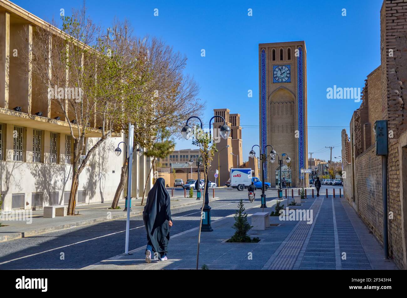 Yazd, Iran - December 5, 2015: Unidentified Iranian woman in chador walking in one of the streets of Yazd in Iran Stock Photo