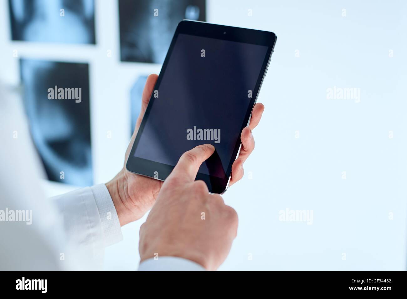 attending physician is using a digital tablet. Stock Photo