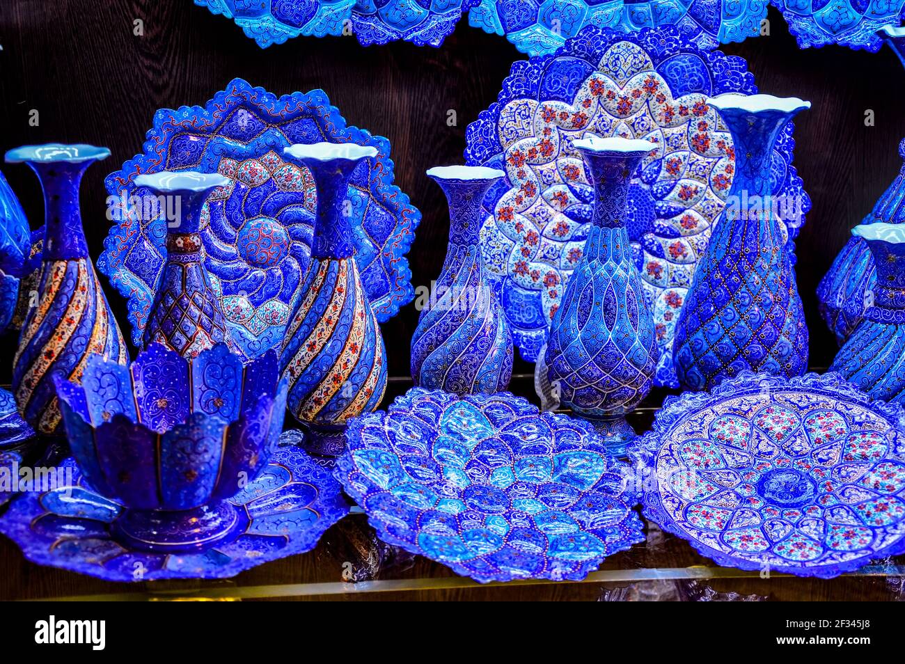 Shiraz, Iran - December 14, 2015: Beautiful blue Persian jugs decorated in the style of minakari (enamel), a traditional handicraft in Iran Stock Photo