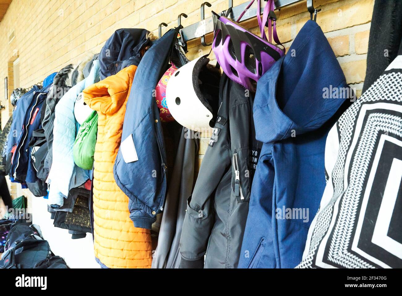 wardrobe rack with children clothes at school Stock Photo
