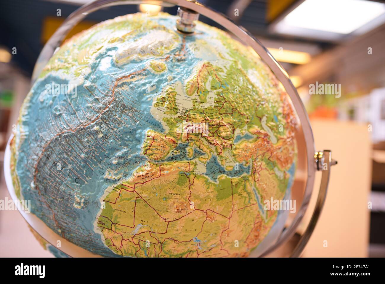 closeup of world map on a colorful glob Stock Photo