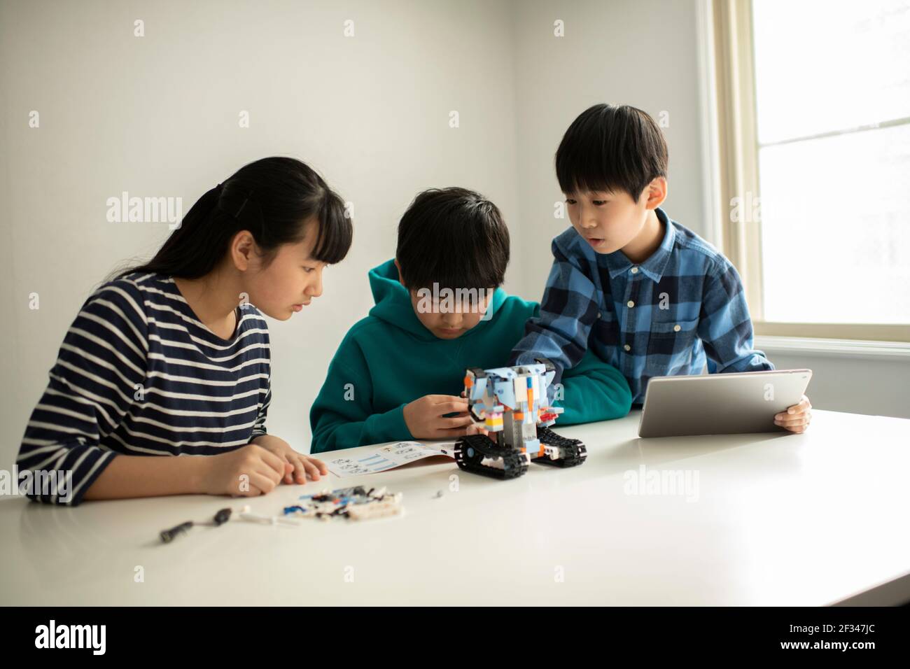 Elementary School Students Assembling Programming Robot Stock Photo - Alamy