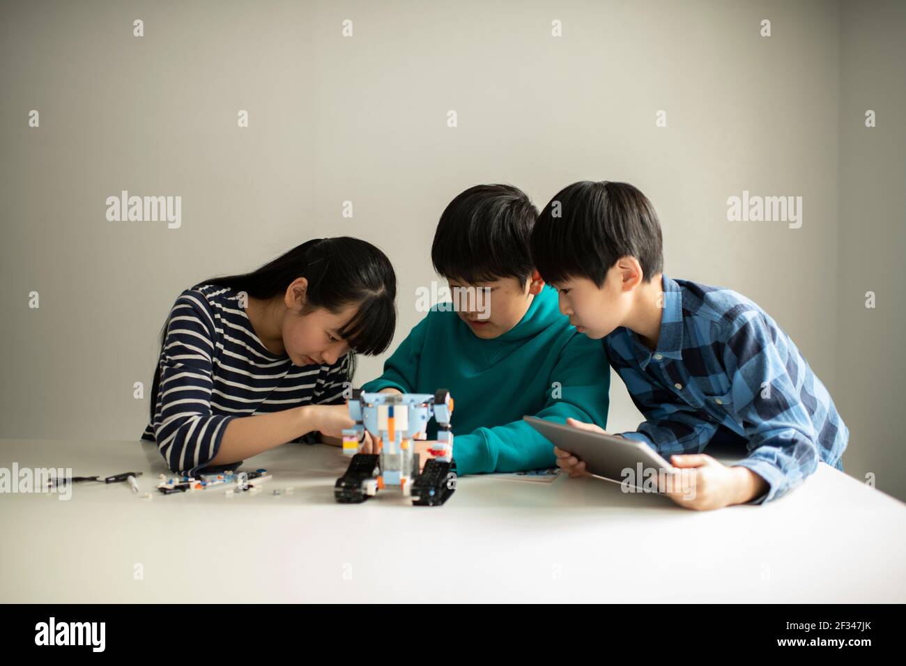 Elementary School Students Assembling Programming Robot Stock Photo - Alamy