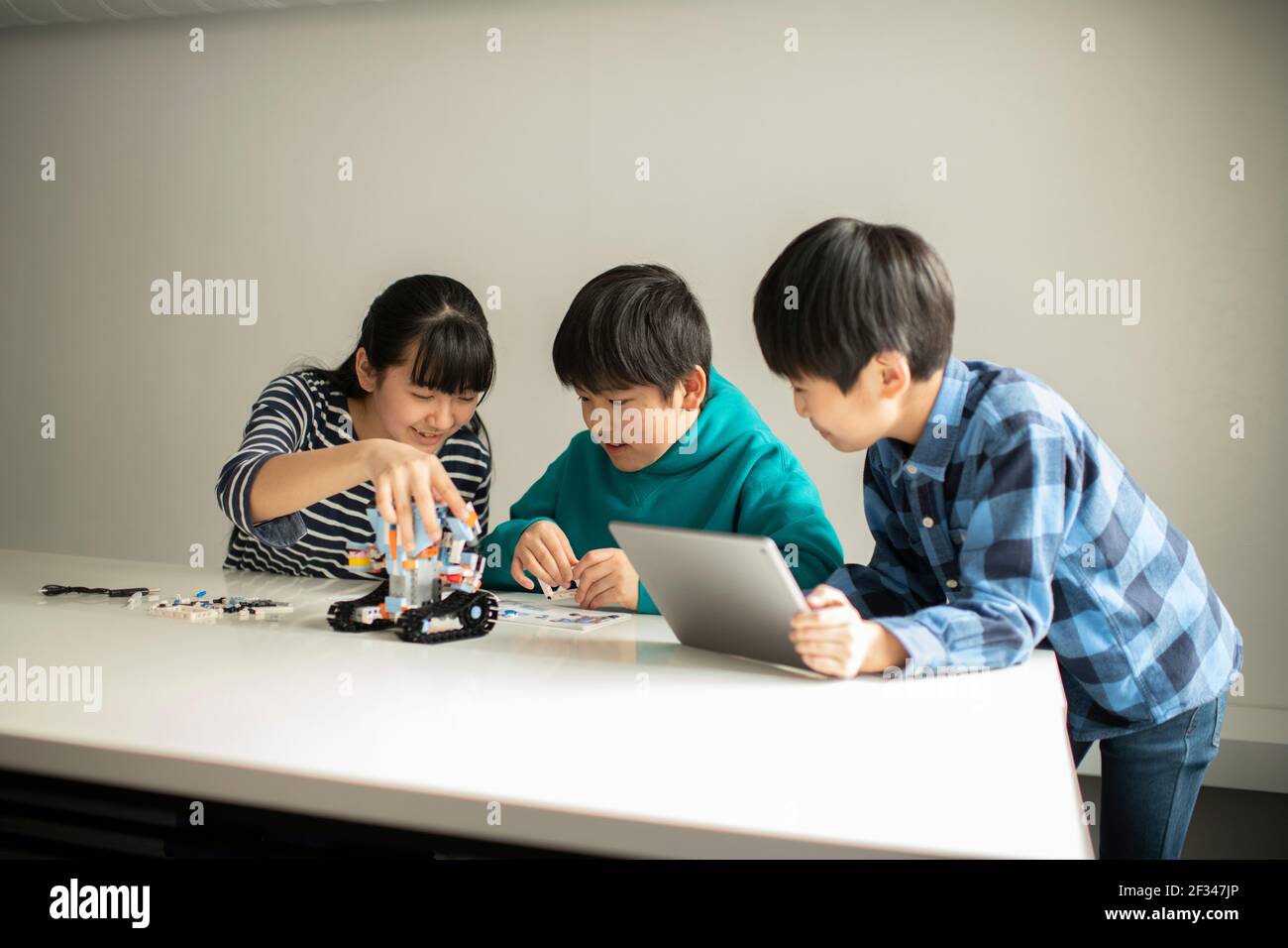 Elementary School Students Assembling Programming Robot Stock Photo - Alamy