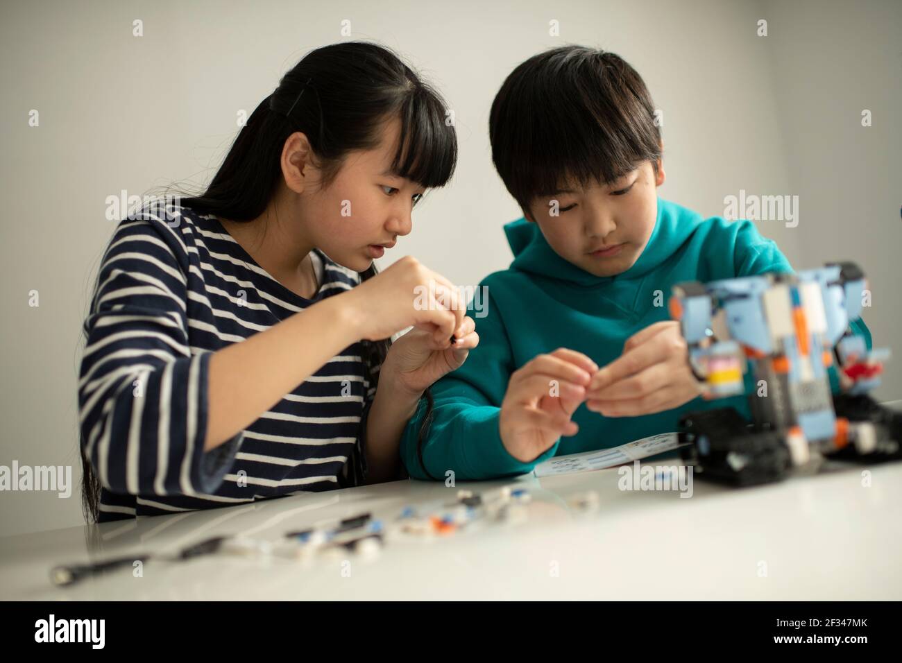 Elementary School Students Assembling Programming Robot Stock Photo - Alamy