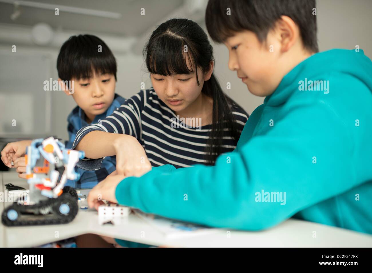 Elementary School Students Assembling Programming Robot Stock Photo - Alamy