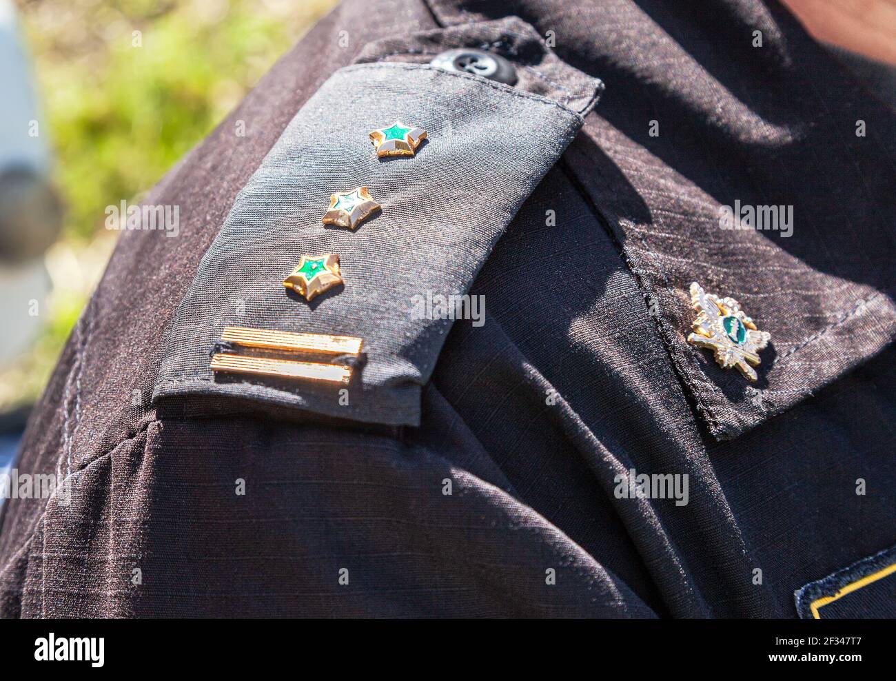 Samara, Russia - May 28, 2016: Shoulder straps with insignia on the bailiff's uniform. Selective focus Stock Photo