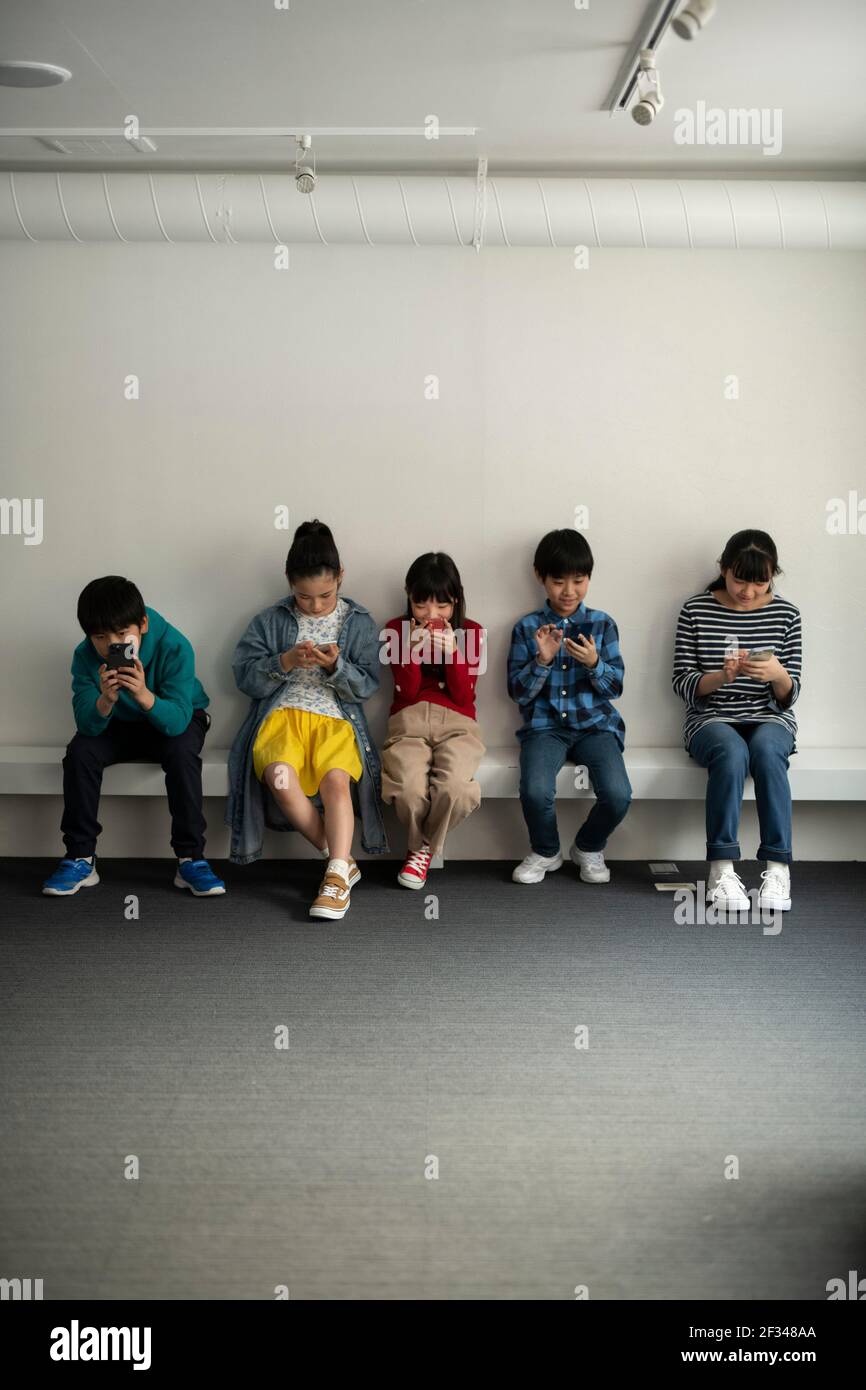 Children Obsessed with Smartphone Stock Photo Alamy