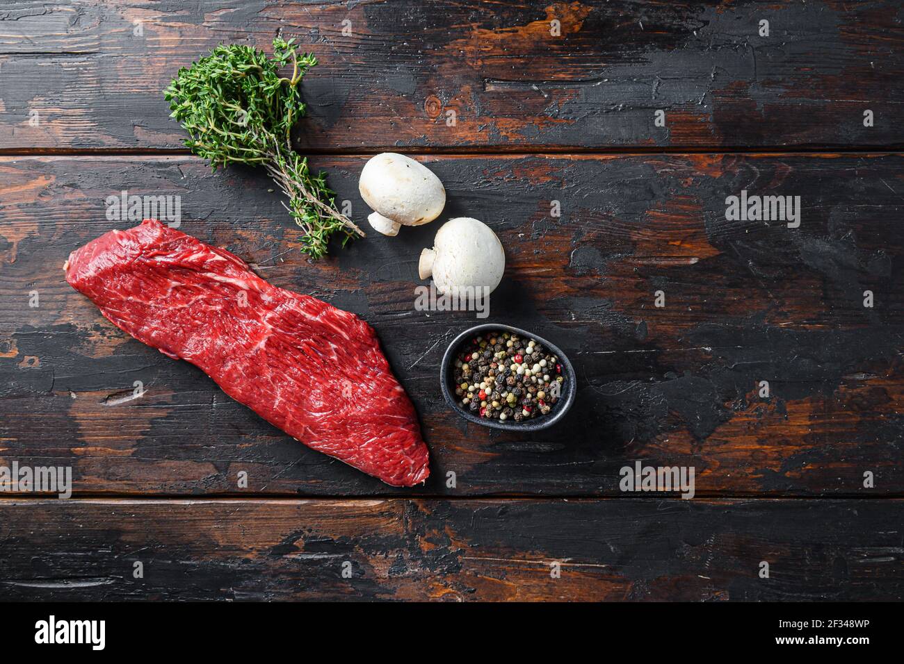 Whole tri tip steak with fresh seasoningsm thyme, organic tritip roast with fat marbled through