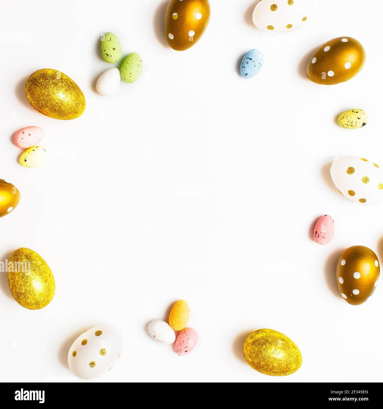 Easter Egg bottom border over a soft white banner background. Top down view with copy space. Stock Photo