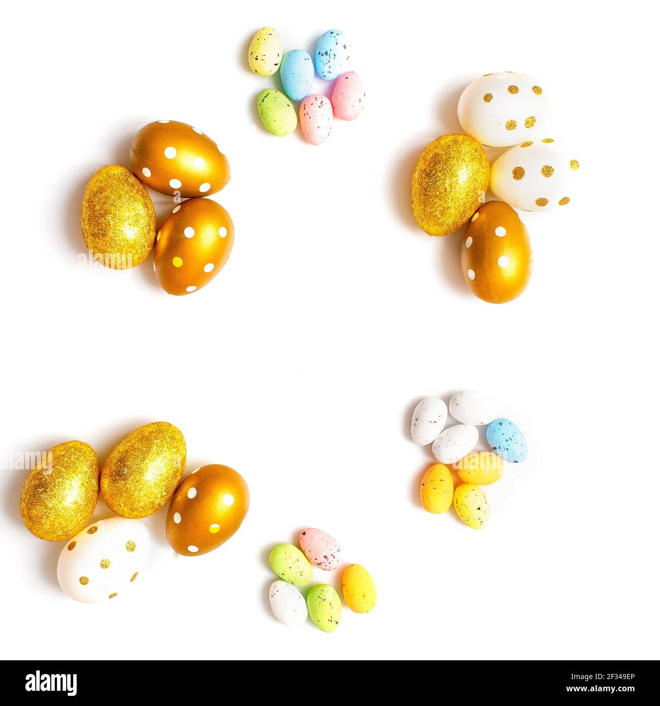 Easter Egg bottom border over a soft white banner background. Top down view with copy space. Stock Photo