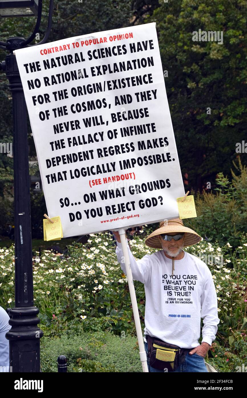 A religious zealot holding a sign claiming that science can&rsquo;t 