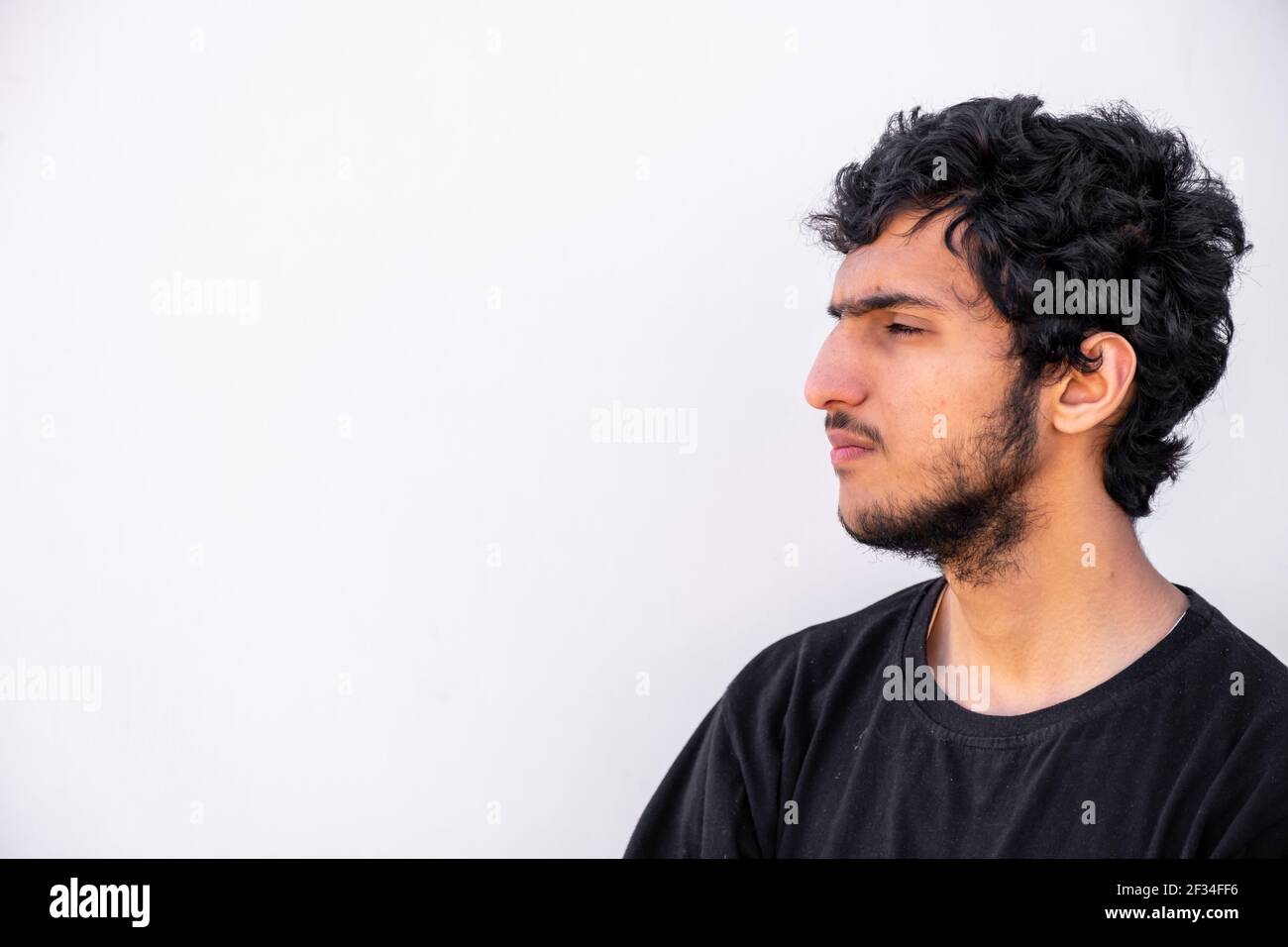 Arabic Muslim man standing to cut his hair Stock Photo - Alamy
