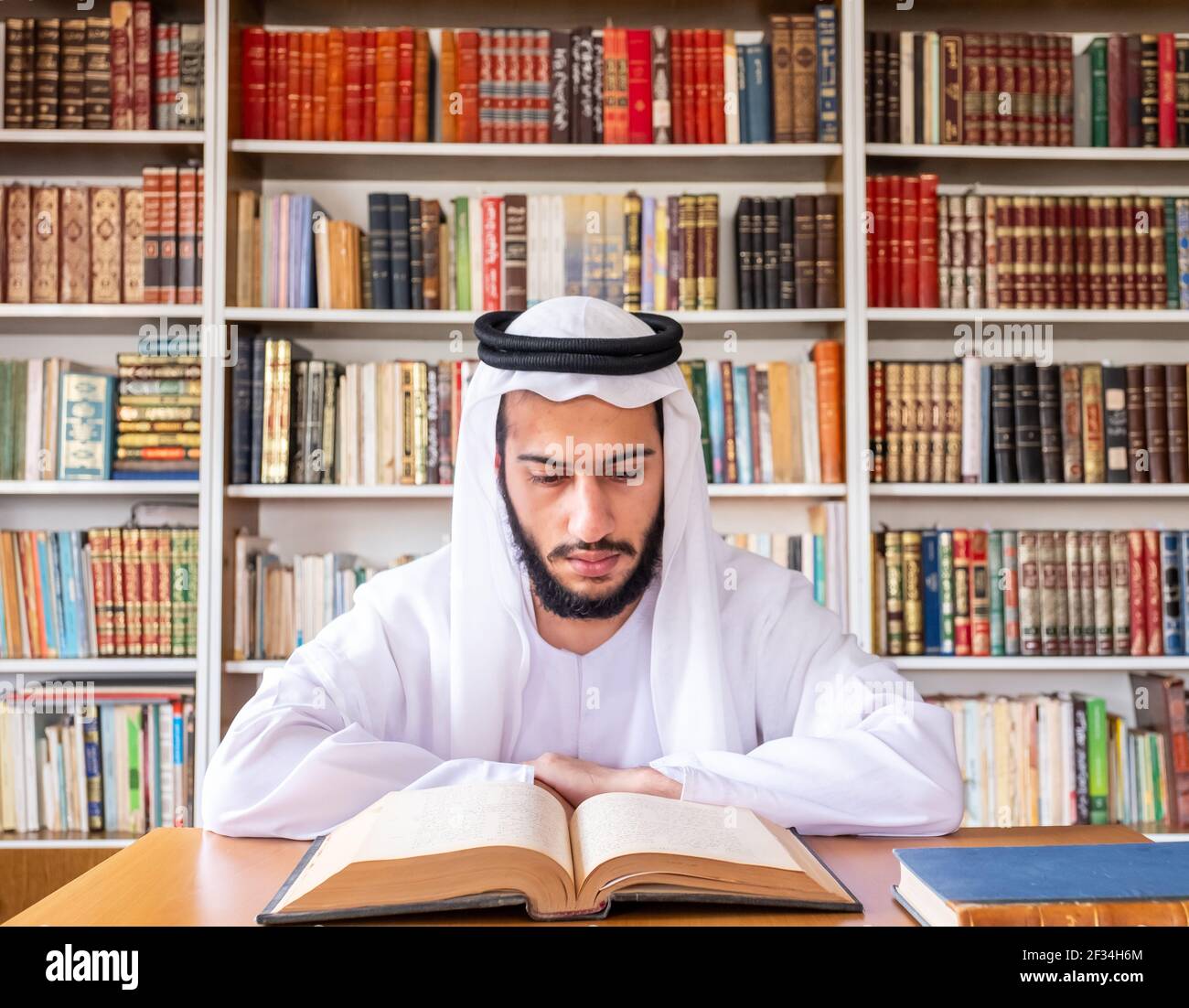 Arabic Muslim man reading old books Stock Photo Alamy