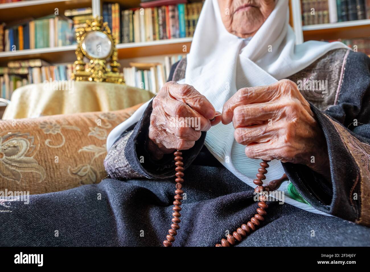 Arabic Muslim man praying for god using rosary Stock Photo