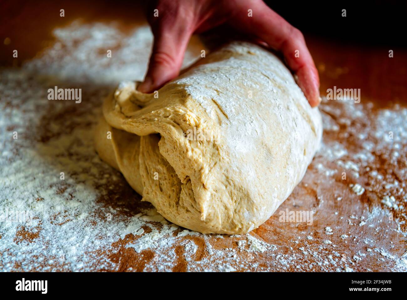 Preparing dough for white bread, rolls, pizza. Yeast dough made from