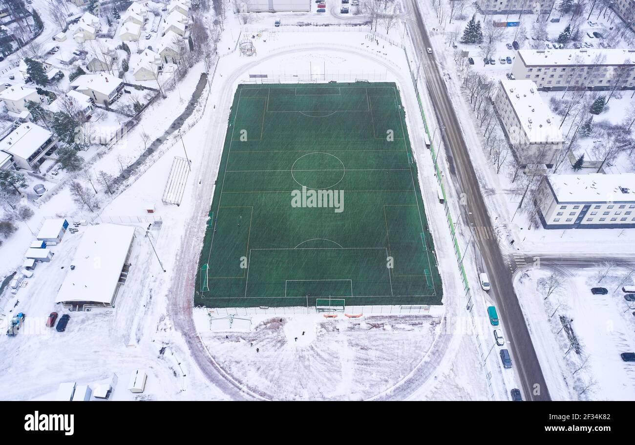 Aerial view of the outdoor football heated field in winter, Finland