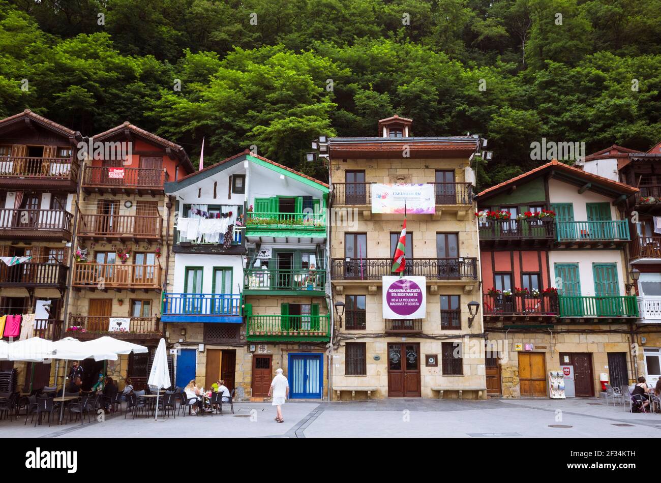 Pasajes, Gipuzkoa, Basque Country, Spain - July 17th, 2019 : Colorful fishermen houses in the Santiago square of Pasajes de San Juan. Town hall and in Stock Photo