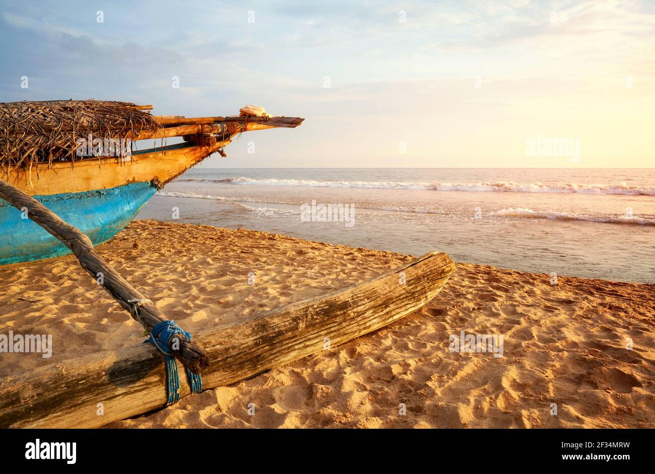 Old wooden boat on beach sunset hi-res stock photography and images - Alamy