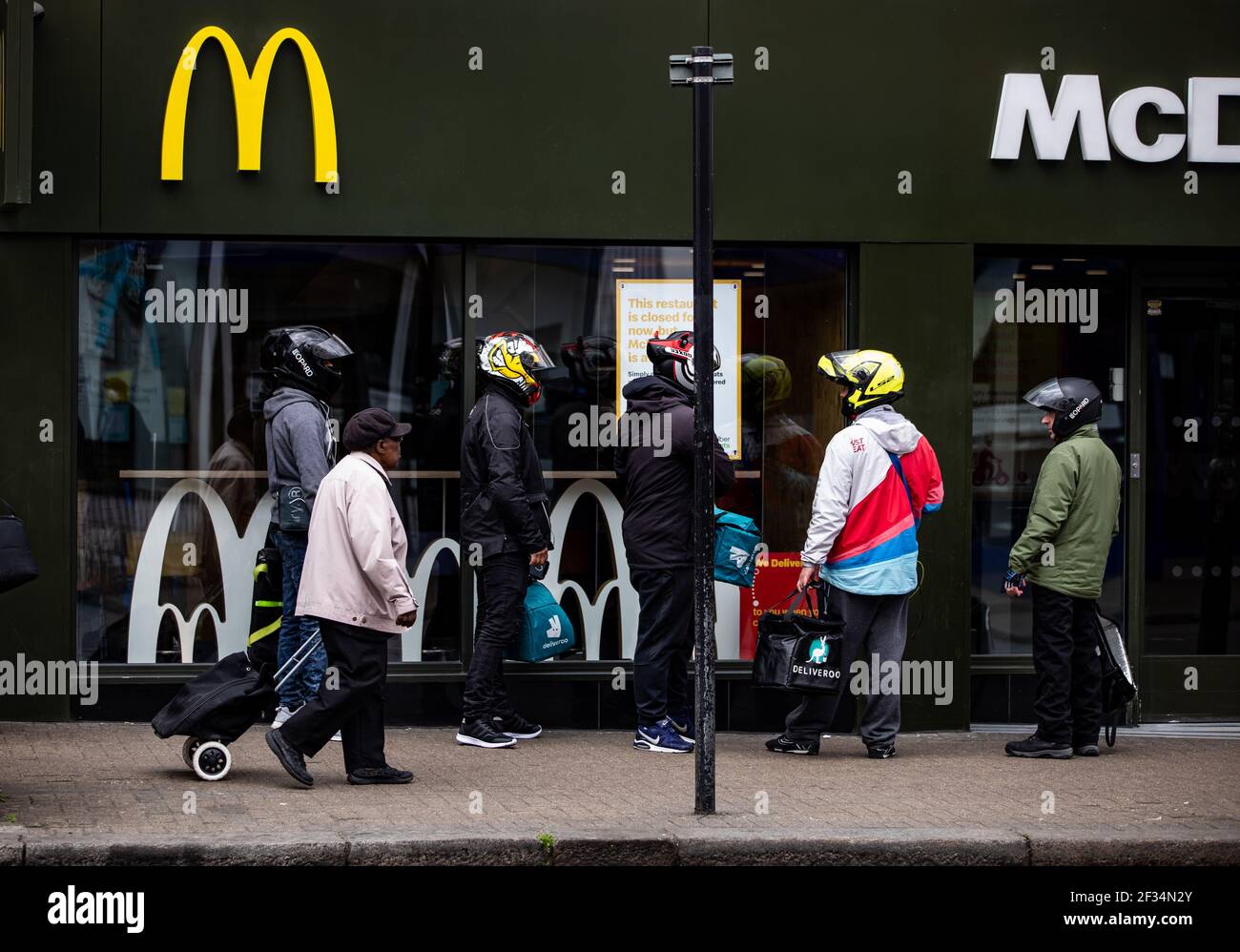 Delivery riders waiting outside McDonald’s in Tooting, South London ...