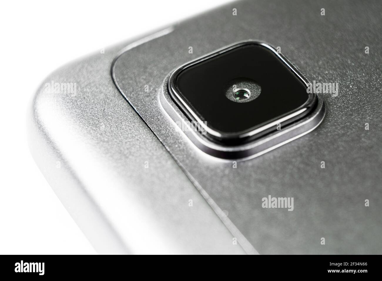 Macro shot closeup of modern mobile phone or tablet camera on back cover. Smartphone or tablet camera close-up. Close up of a mobile phone camera Stock Photo