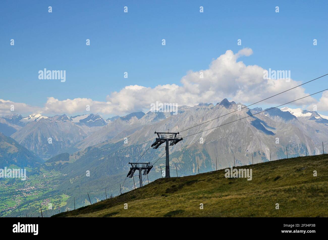 Austria, Tirol, cable car to Goldried mountain with view to Austrian Alps and village of Matrei in East-Tyrol Stock Photo