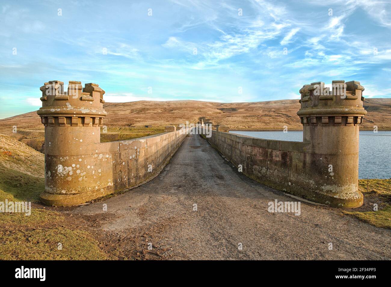 Angram reservoir dam, looking along the roadway on top of the dam with its grand stonework,  Angram and Scar House reservoirs are in Upper Nidderdale Stock Photo