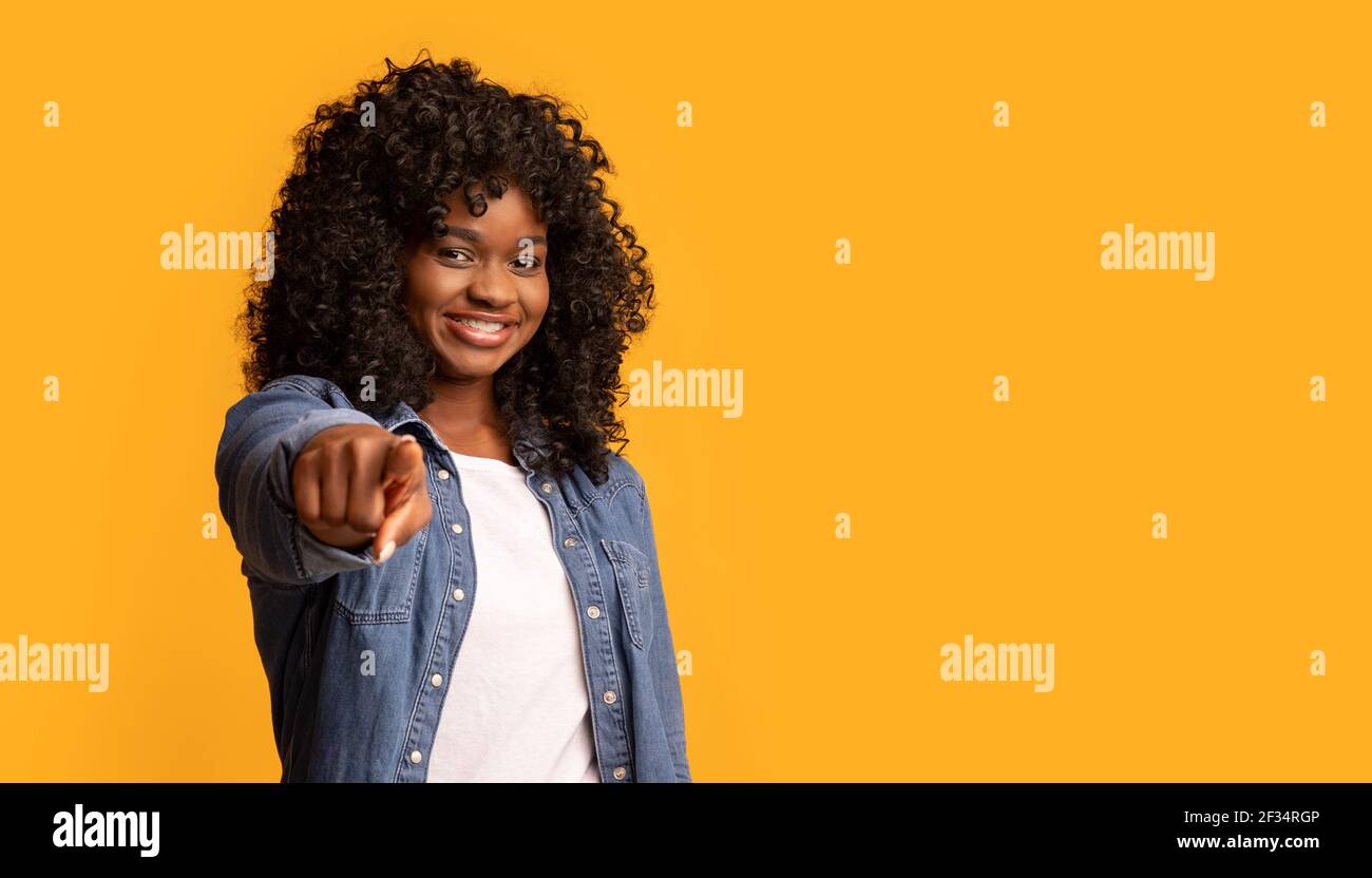 Happy black woman indicating hi-res stock photography and images - Alamy