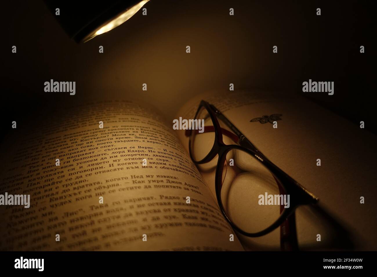 an open book with glasses from above Stock Photo