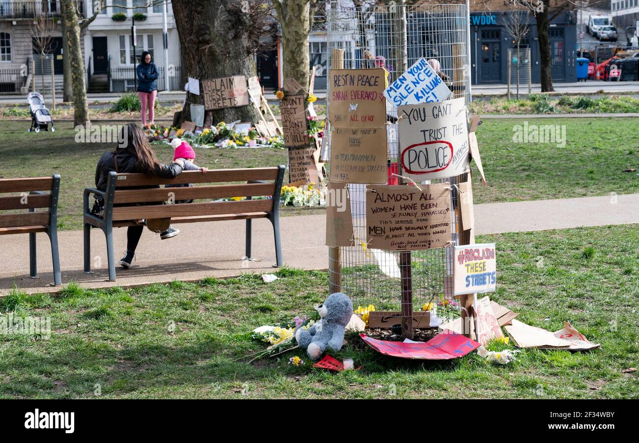 Brighton UK 15th March 2021 - Floral tributes and messages for murder victim Sarah Everard and some anti police messages left at Valley Gardens in Brighton where a candlelit vigil was held on Saturday :  Credit Simon Dack / Alamy Live News Stock Photo