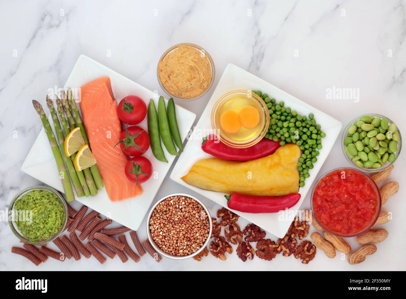 Low glycemic food for diabetics for a healthy diet with vegetables, seafood, grains, dairy, nuts,pasta & dips. All foods below 55 on the GI scale. Stock Photo