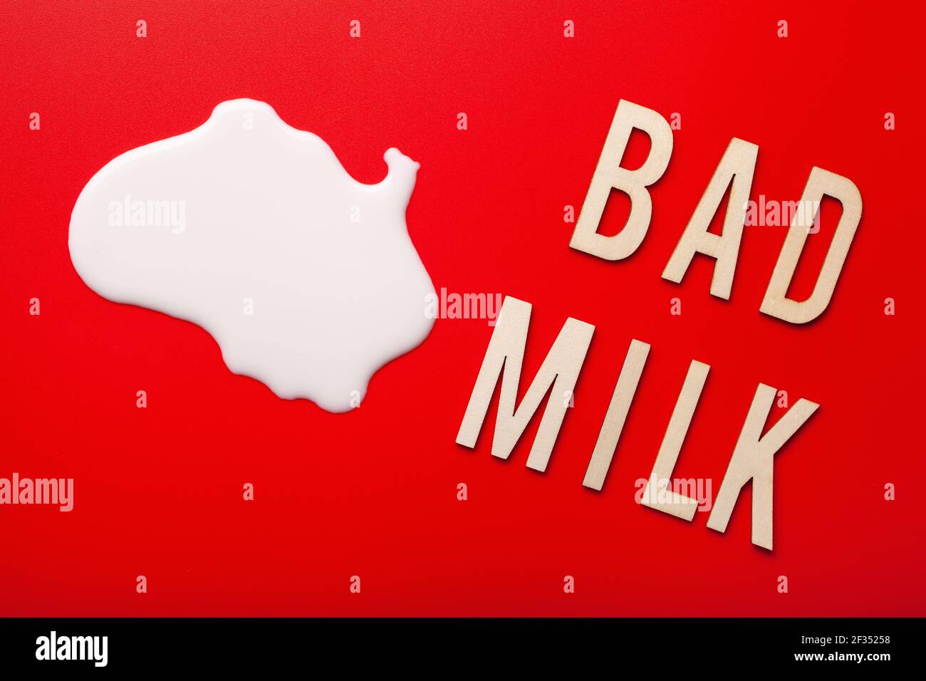 bad milk word letter text lactose intolerance allergy. milk splatter. avoid dangerous dairy
