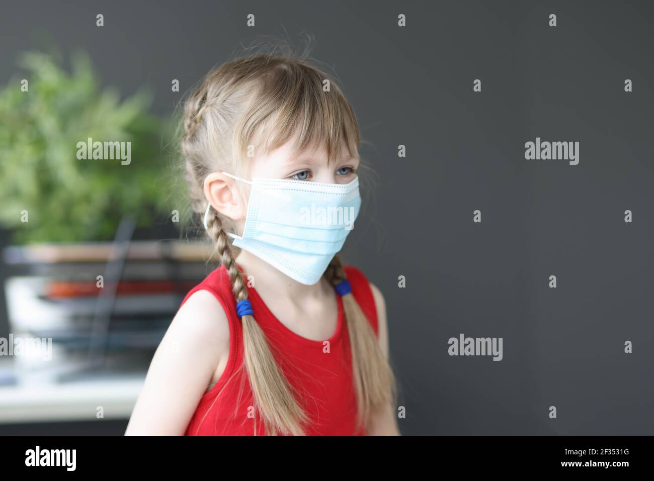 Portrait of little girl in medical protective mask Stock Photo - Alamy