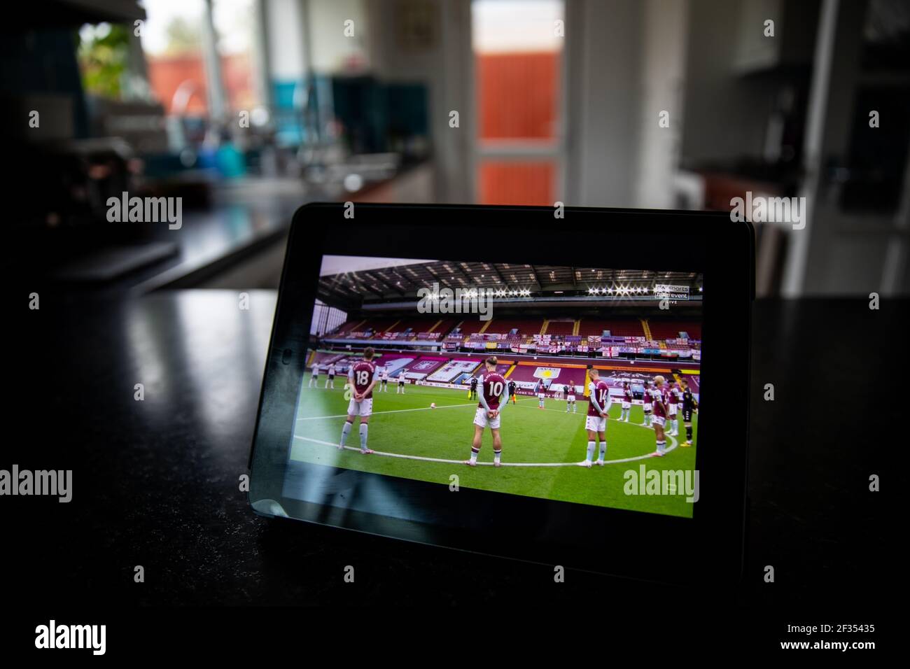 The game being stream on the Sky Go app on a iPad as Aston Villa play Sheffield United in the first Premier League match back following the Coronaviru Stock Photo