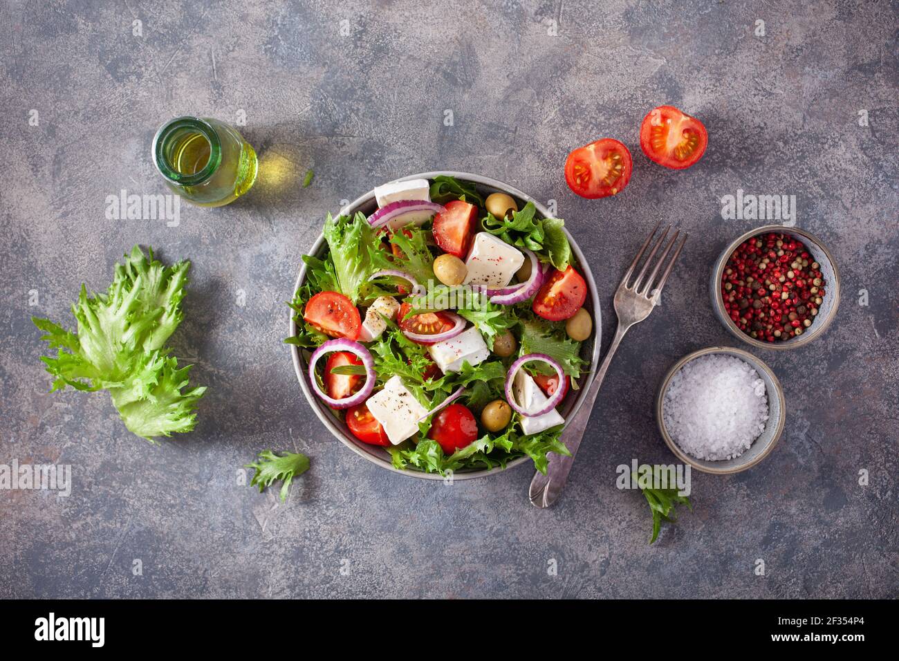 tomato salad with brie cheese olives onion lettuce Stock Photo Alamy