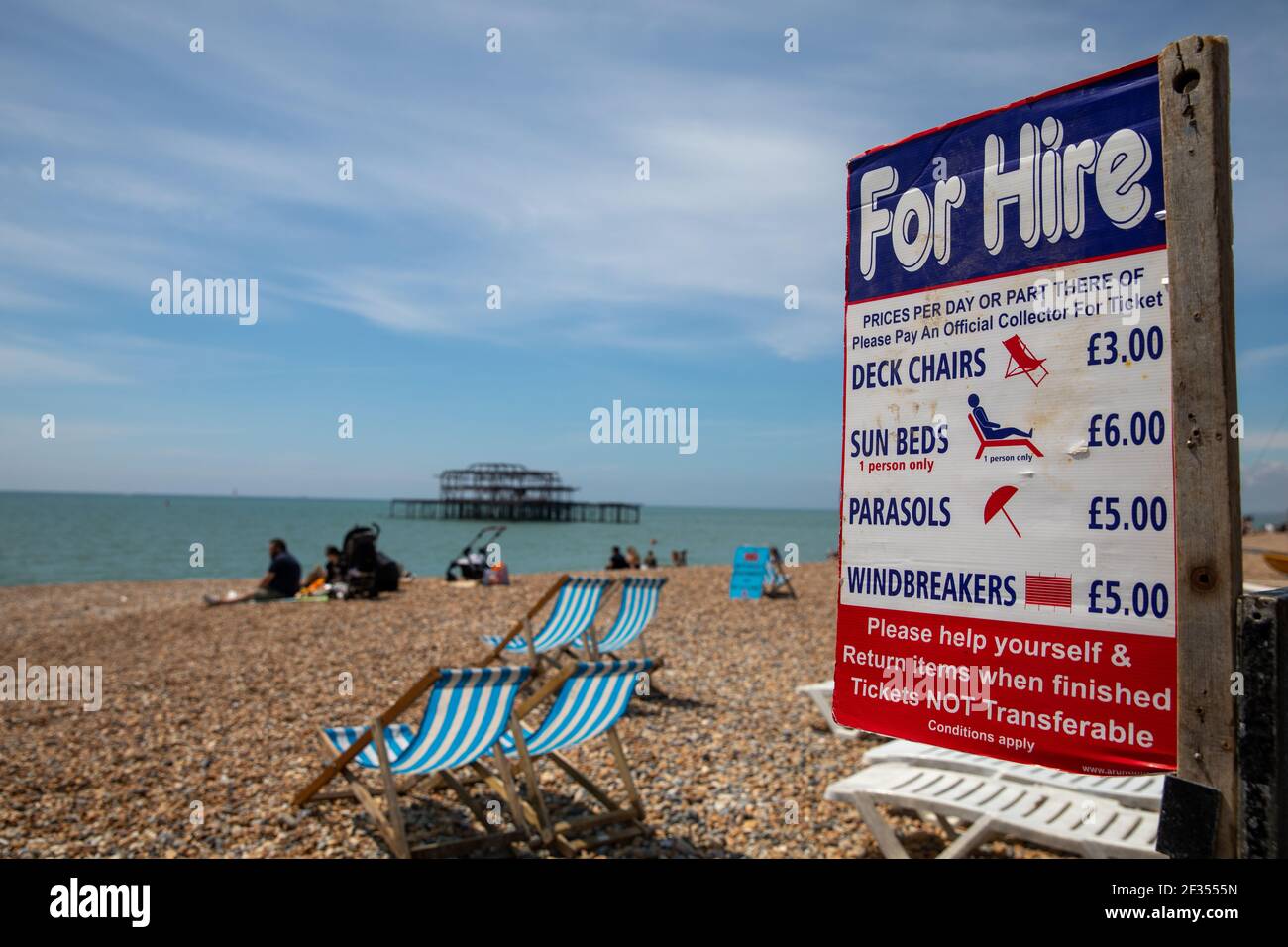 General view of deck chairs for hire on the beach in Brighton Stock