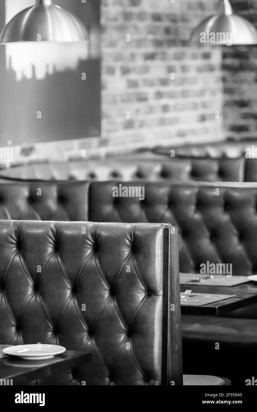 A vertical greyscale shot of the interior of a Retro Sushi Restaurant in Johannesburg, South Africa Stock Photo
