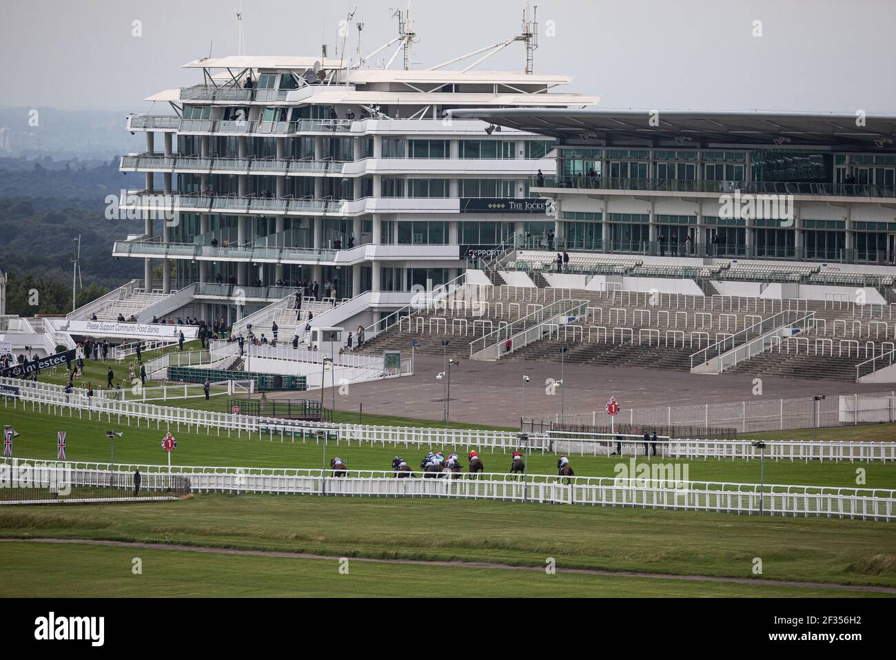 General view of the empty grandstand during the Investec Handicap race at Epsom Racecourse Stock Photo