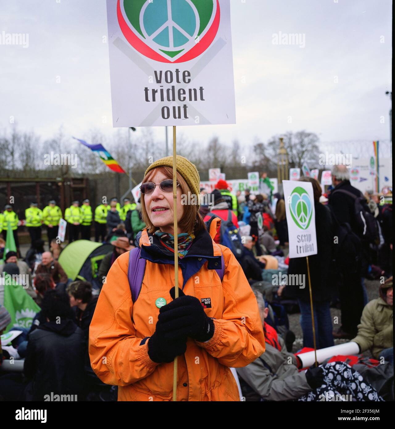 Protestors staging a sit in outside Her Majesty's Naval Base at Faslane on Gare Loch, Argyll and Bute on the west coast of Scotland. The facility, is one of three operating bases in the United Kingdom for the Royal Navy and is their headquarters in Scotland. It is best known as the home of Britain's nuclear weapons, in the form of nuclear submarines armed with Trident missiles and is also the site of the Faslane Peace Camp. Stock Photo