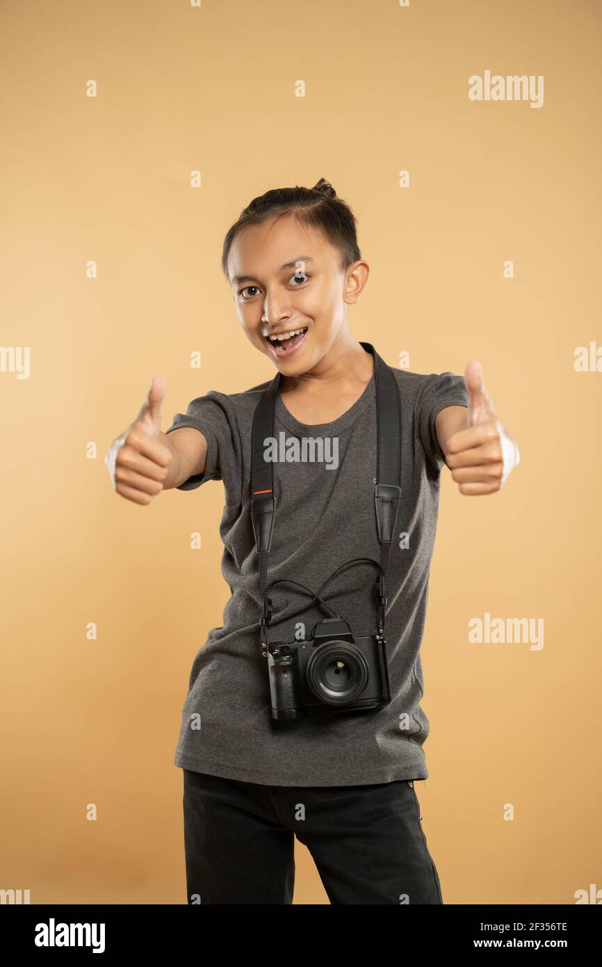 photographer smiling holding his professional camera gear Stock Photo ...