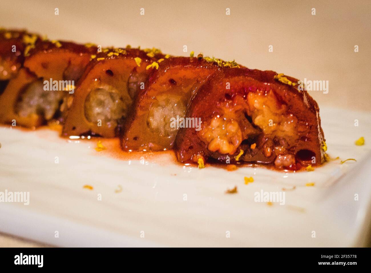 typical Shanghai Hangzhou appetiser or lotus root stuffed with sweet sticky rice, sweet